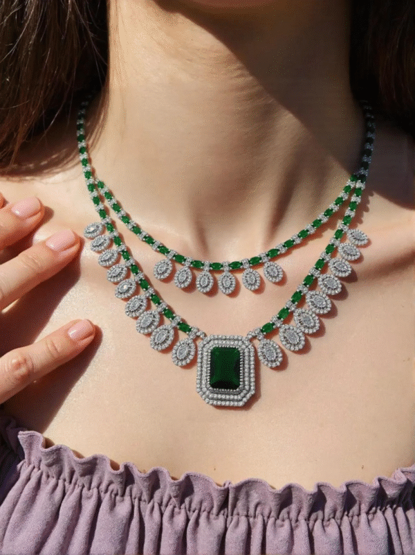 “American Diamond bridal jewellery set with green stones – necklace, earrings, and maang tikka”