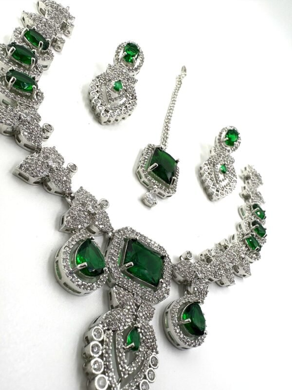 AD Stone Jewellery Set with green stones in nano setting – necklace, earrings, and maang tikka bridal collection by Tapasvini