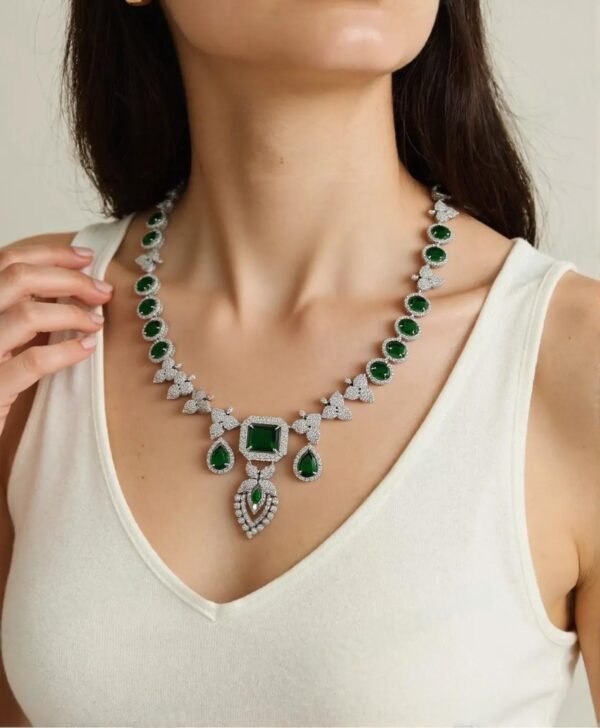 AD Stone Jewellery Set with green stones in nano setting – necklace, earrings, and maang tikka bridal collection by Tapasvini